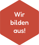 Rote Wabe mit dem Schriftzug „Wir bilden aus!"